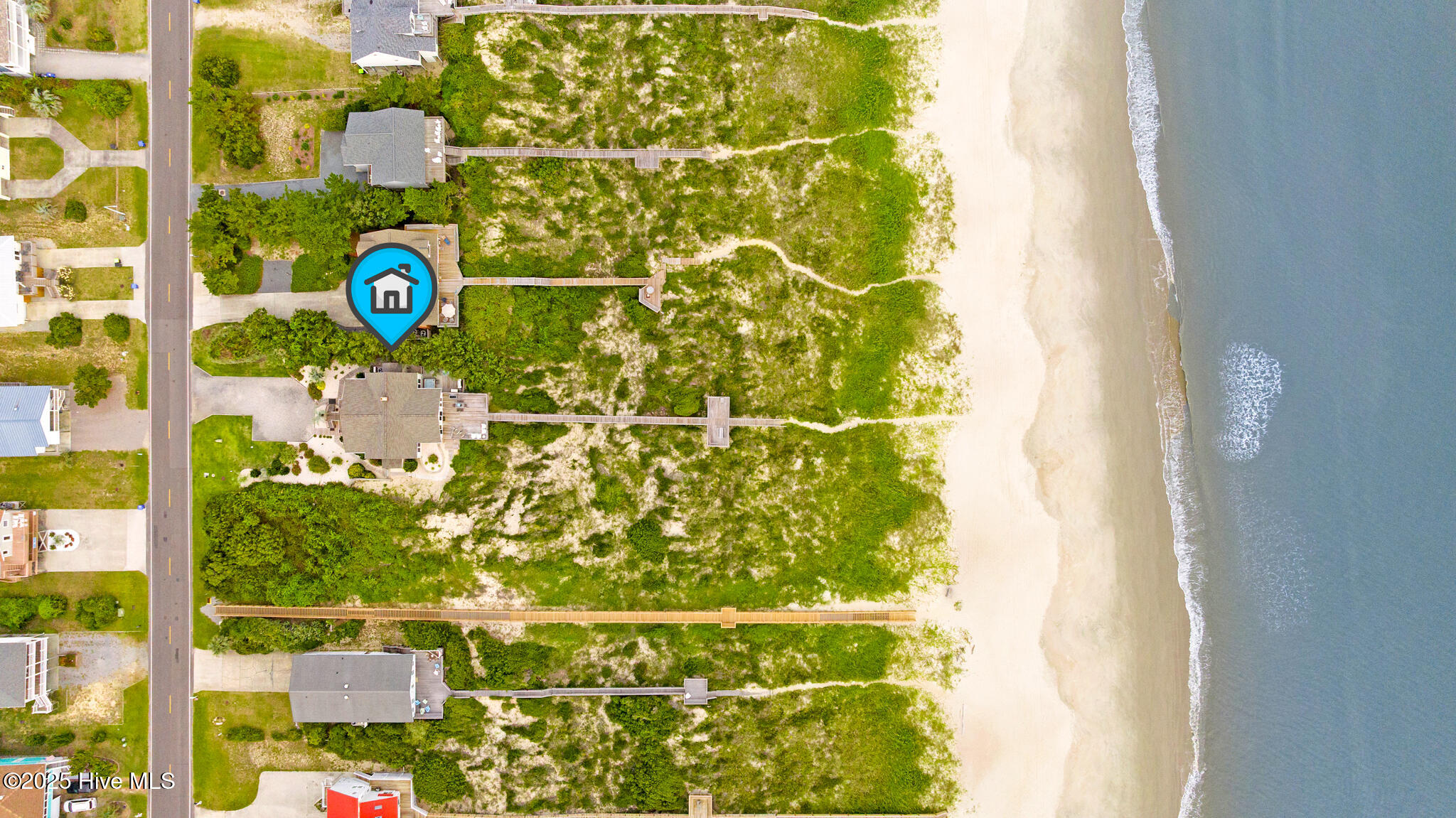 Exterior view of 419 Caswell Beach Road, Oak Island, NC 28465